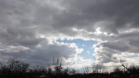 Sunlight-Behind-Sliding-Clouds-In-Overcast-Sky.-Timelapse