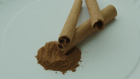 Close-Up-Pan-Right-of-Cinnamon-Sticks-and-Ground-Cinnamon