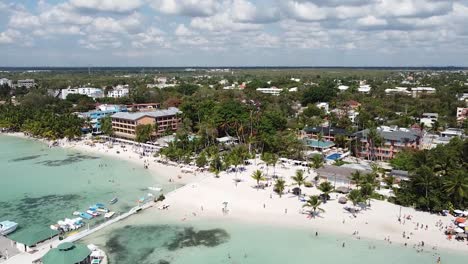 DOMINICAN-REPUBLIC---BOCA-CHICA-2022---Wide-shot-aerial-over-resort-hotels-for-tourists-in-the-Caribbean