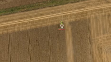 Harvest-drone-follow-combine-harvester-as-it-crops-down-a-field