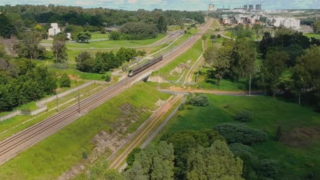 Elevated-drone-shot-of-train-passing-by