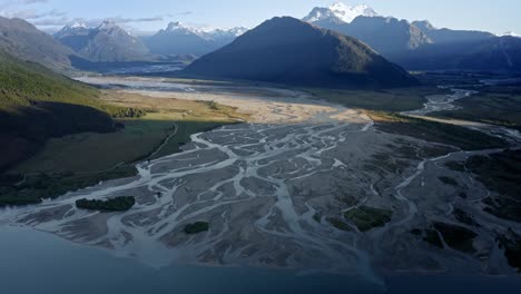 Amazing-river-delta-running-down-from-snow-capped-mountains-in-Glenorchy,-New-Zealand