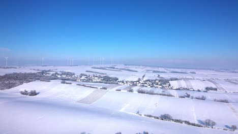 Sweeping-View-Of-Snowscape-Plains-And-Wind-Turbines-During-Winter-In-Weinviertel,-Zistersdorf,-Lower-Austria