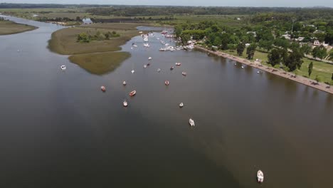Aerial-top-down-shot-of-anchored-fishing-boats-on-Santa-Lucia-River-in-Uruguay