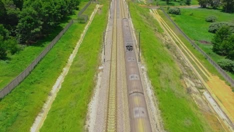 Oncoming-train-pull-back-drone-shot