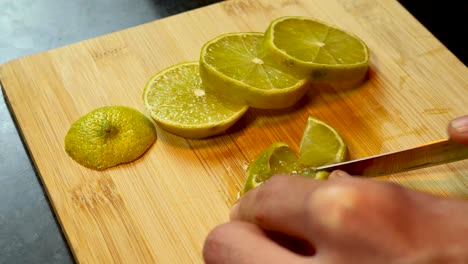 Cutting-a-lime-in-pieces-shot-on-4k