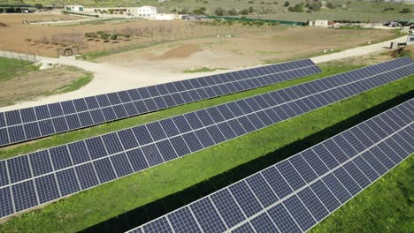 Fly-over-solar-panels,-Solar-power-plant-in-Lagos-Portugal