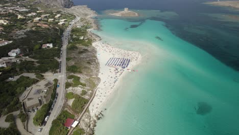 Aerial-establishing-shot-of-the-La-Pelosa-one-of-the-most-beautiful-sandy-beaches-on-the-Emerald-Coast-in-the-Mediterranean
