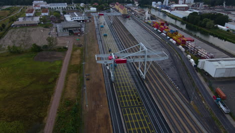 Aerial-View-Of-Container-Port-Crane-At-Empty-Yard