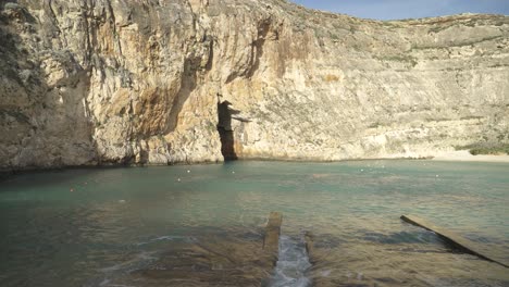 Inland-Sea-Caves-Area-in-Malta-with-Buoys-in-Water-on-Sunny-Winter-Day-in-Gozo-Island