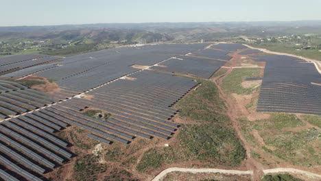 Aerial---vast-solar-farm-in-countryside-of-Lagos,-Portugal
