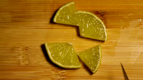 Organic-citrus-lime-being-cut-in-4k