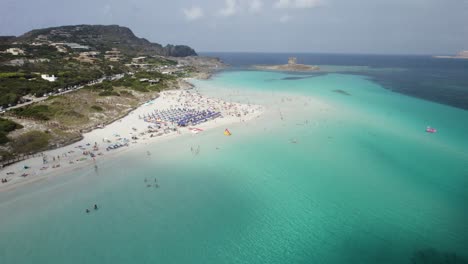Aerial-approach-to-the-La-Pelosa-one-of-the-most-beautiful-beaches-on-the-Emerald-Coast-in-Sardinia