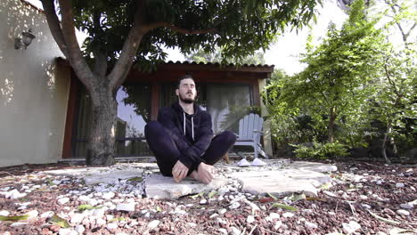 Hispanic-meditating-at-luxury-terrace-suite-at-Golan-Heights-Israel