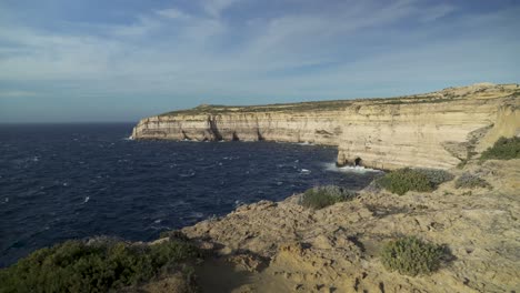 Dark-Blue-Deep-Mediterranean-Sea-Waving-in-Wind-near-Coastline-of-Gozo-Island