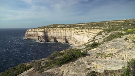 Panoramic-View-of-Mediterranean-Sea-and-Cliffs-of-Gozo-Island-on-Windy-Day