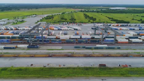 4K-Drone-Video-of-Trains-and-Trucks-at-CSX-Intermodal-Train-Yard-in-Winter-Haven,-FL
