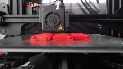 A-hot-bed-of-a-3D-printer-moving-with-the-extruder