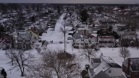 An-aerial-view-of-a-suburban-neighborhood-after-a-nor'easter-on-a-cloudy-day