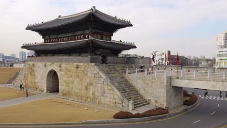 Korean-people-in-protective-masks-during-covid-19-visiting-Janganmun-North-Gate-of-Hwaseong-Fortress