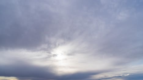Cloud-cover-crossing-the-sky-as-the-sun-descends-towards-the-horizon---cloudscape-time-lapse
