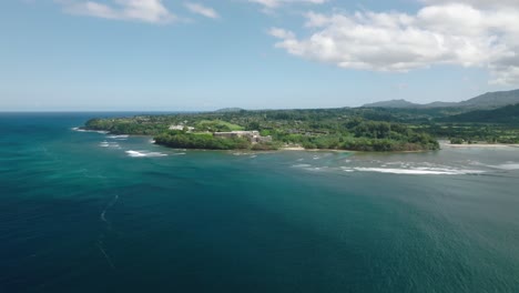 Princeville-coastline-aerial-view,-on-the-north-shore-of-Kauai-island-in-Hawaii,-United-States,-on-sunny-summer-day