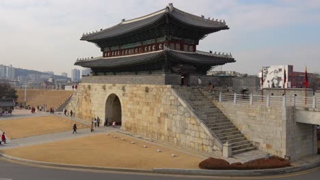 Travellers-visiting-Hwaseong-Fortress-North-Gate-in-Suwon-city,-South-Korea-in-winter