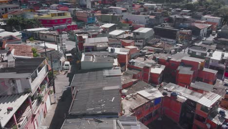 Aerial-landscape-image---Flying-over-slum-subway-rail-in-district-of-Capão-Redondo,-São-Paulo-City-in-Brazil