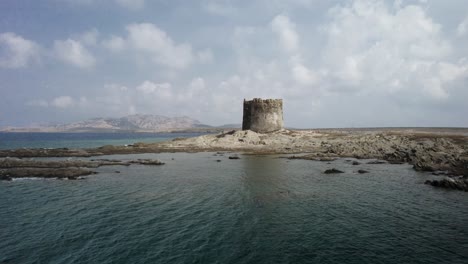 An-aerial-slow-approach-to-the-medieval-watchtower-built-in-the-XVI-century-on-a-small-rocky-island