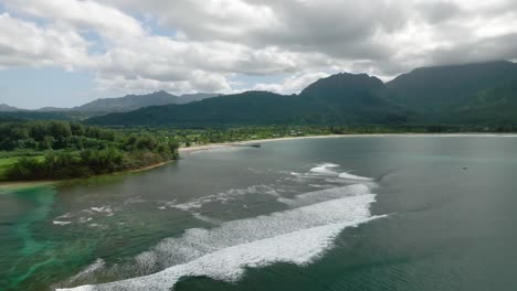 panoramic-aerial-over-Hanalei-Bay-beach-in-Hawaii,-at-cloudy-summer-day