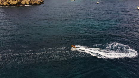 Tourists-Jet-Skiing-In-The-Ocean-Near-Ibiza-Island-In-Spain-At-Summer