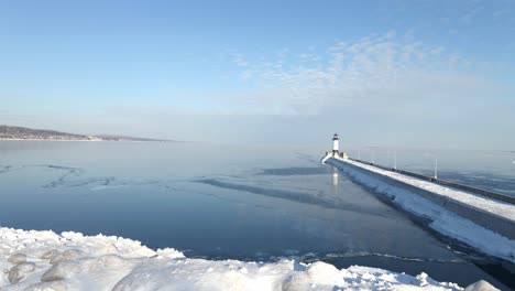 Light-house-on-a-winter-sunny-afternoon-water-completly-frozen
