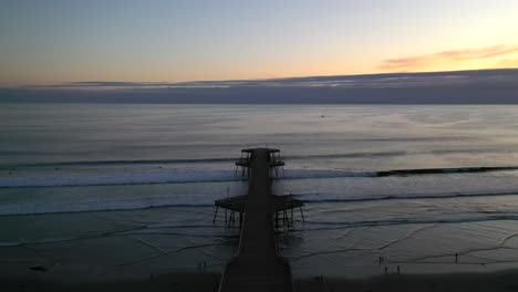 Aerial-Revealed-Pismo-Beach-Pier-In-California,-The-United-States-During-Sunset