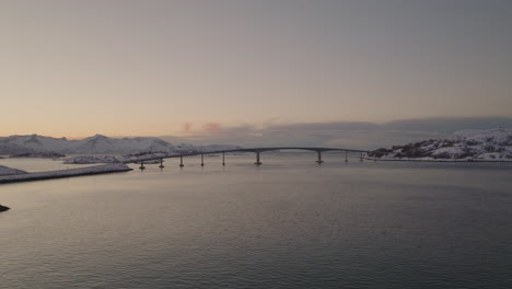 Panoramic-View-Of-Sommaroya-With-Bridge-And-Archipelago-Near-Tromso,-Norway-In-Winter---aerial-drone-shot