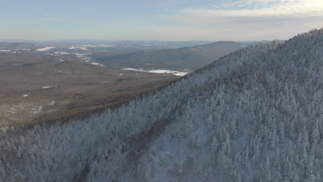 Aerial-View-Of-Winter-Mountains-On-Foggy-Morning-Near-Sutton,-Canada