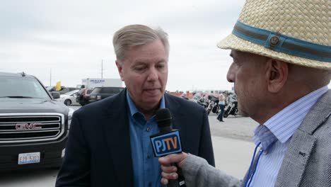 Republican-Party-Presidential-Candidate-Lindsay-Graham-Talks-With-The-Press-At-A-Campaign-Stop-In-Iowa