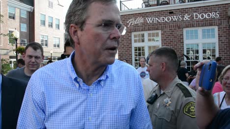 Republican-Party-Presidential-Candidate-Jeb-Bush-Talks-With-A-Citizen-Journalist-At-A-Campaign-Event-In-Iowa