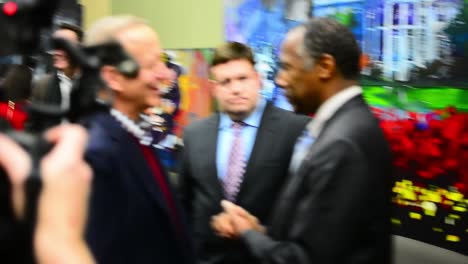 Republican-Presidential-Candidate-Ben-Carson-And-Frank-Luntz-Talk-With-A-Newsman-Between-Iowa-Campaign-Events