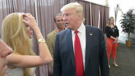 Donald-Trump-Speaks-With-Conservative-Commentator-Ann-Coulter-Before-Entering-A-Political-Rally,-Iowa-Caucus