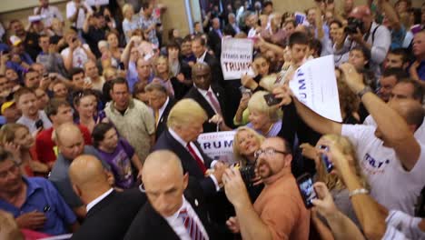 Us-Republican-Presidential-Candidate-Donald-Trump-Shakes-Hands-With-A-Crowd-Of-Supporters-During-The-Iowa-Caucus-Policital-Campaign