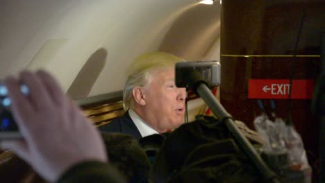 Us-Republican-Presidential-Candidate-Donald-Trump-Talks-To-Reporters-On-His-Airplane-About-His-Political-Opponents-During-The-Iowa-Caucus