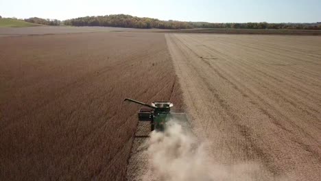 Aerial-Drone-Footage-Of-An-Iowa-Farmer-Driving-A-Mechanized-Combine-Harvestor-In-A-Corn-Field-On-Sunny-Midwest-Day-In-The-Rural-American-Farm-Belt