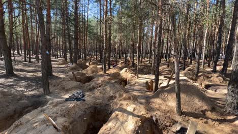Mass-Graves-Suggest-Russian-War-Crimes-In-A-Forest-In-Izium,-Ukraine-Following-The-Regions-Liberation