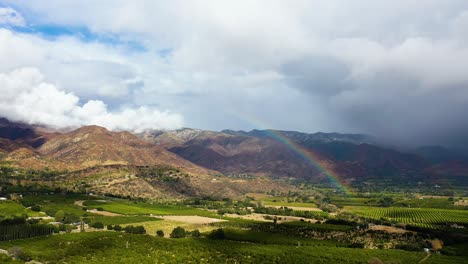 Excellent-Aerial-Shot-Of-A-Rainbow-Over-Farmland-In-Ojai,-California