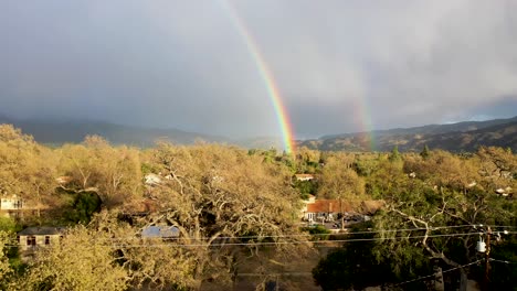 Excellent-Aerial-Shot-Of-A-Rainbow-Over-A-Suburb-In-Ojai,-California