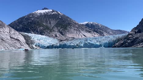 Tourists-Ride-Speedboats-Past-Dawes-Glacier-In-Alaska