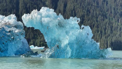 Tourists-On-An-Inflatable-Boat-Pass-An-Iceberg-In-Alaska'S-Laconte-Bay