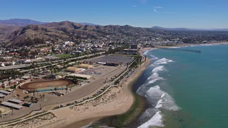 Excellent-Aerial-Shot-Of-Waves-Lapping-The-Shoreline-By-The-Ventura-Fairgrounds-In-California