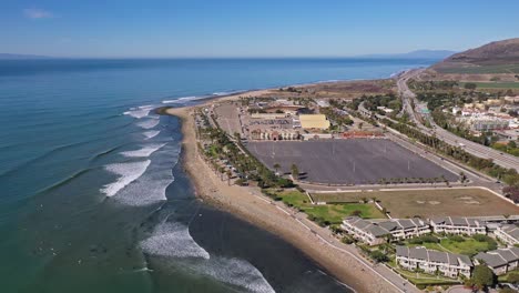 Excellent-Aerial-Shot-Of-Waves-Hitting-The-Shore-Near-The-Fairgrounds-In-Ventura,-California