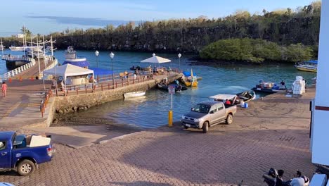Time-Lapse-Photography-Of-Heavy-Road-And-Water-Traffic-In-Puerto-Ayora-Harbor-Of-The-Galapagos